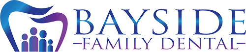 The image shows a logo with the text BAYSIDE FAMILY DENTAL prominently displayed, featuring a stylized graphic of a toothbrush with a smiley face design, against a background that transitions from purple to gray.